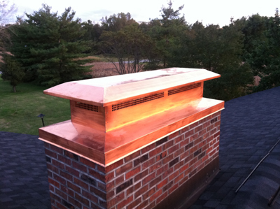 Before and after chimney cap replacement in Amityville, NY
