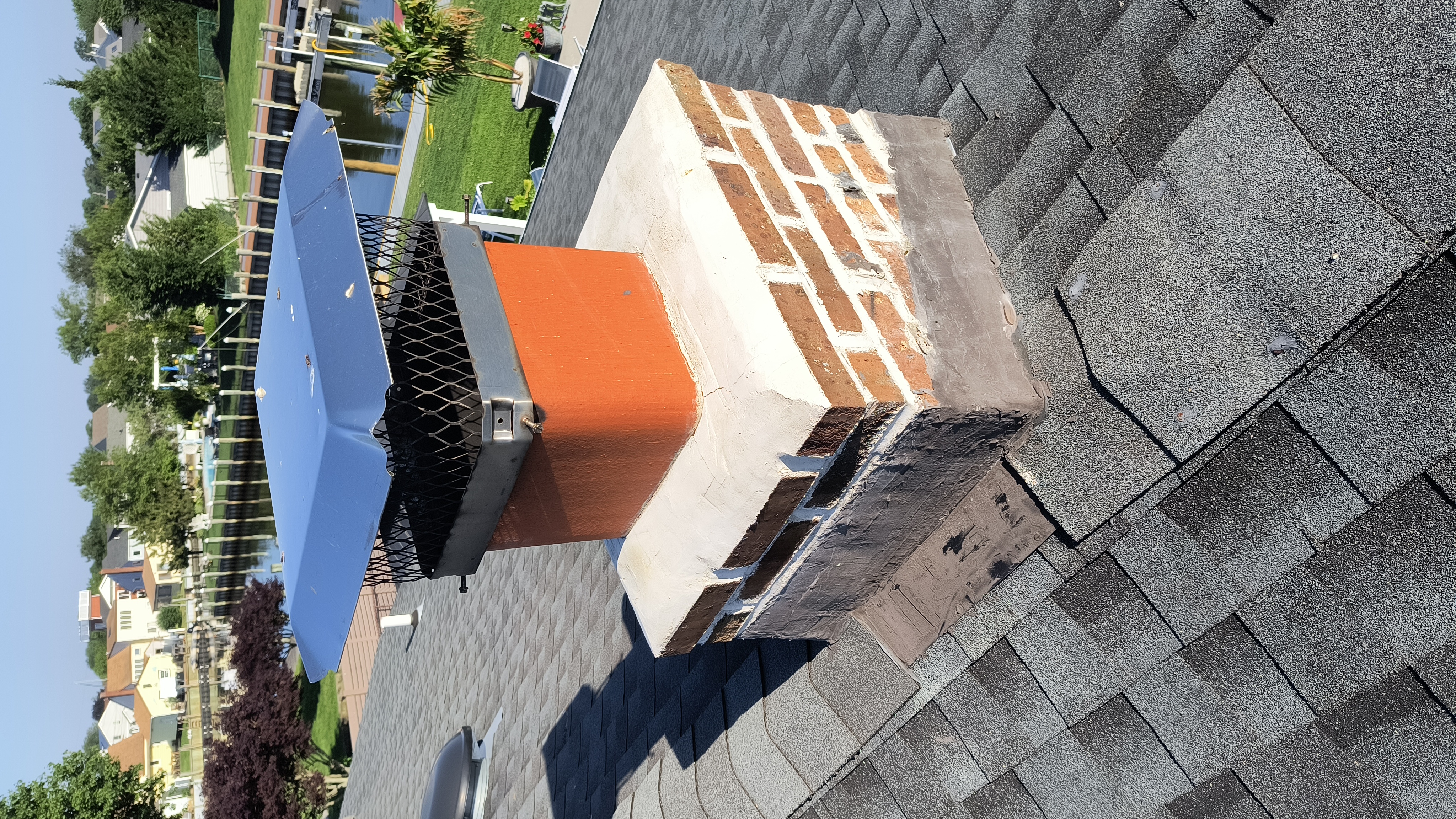 Full chimney masonry rebuild and restoration in Amityville, NY