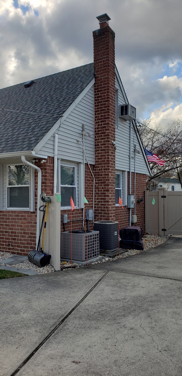 Professional chimney repointing restoring brick joints in Amityville, NY