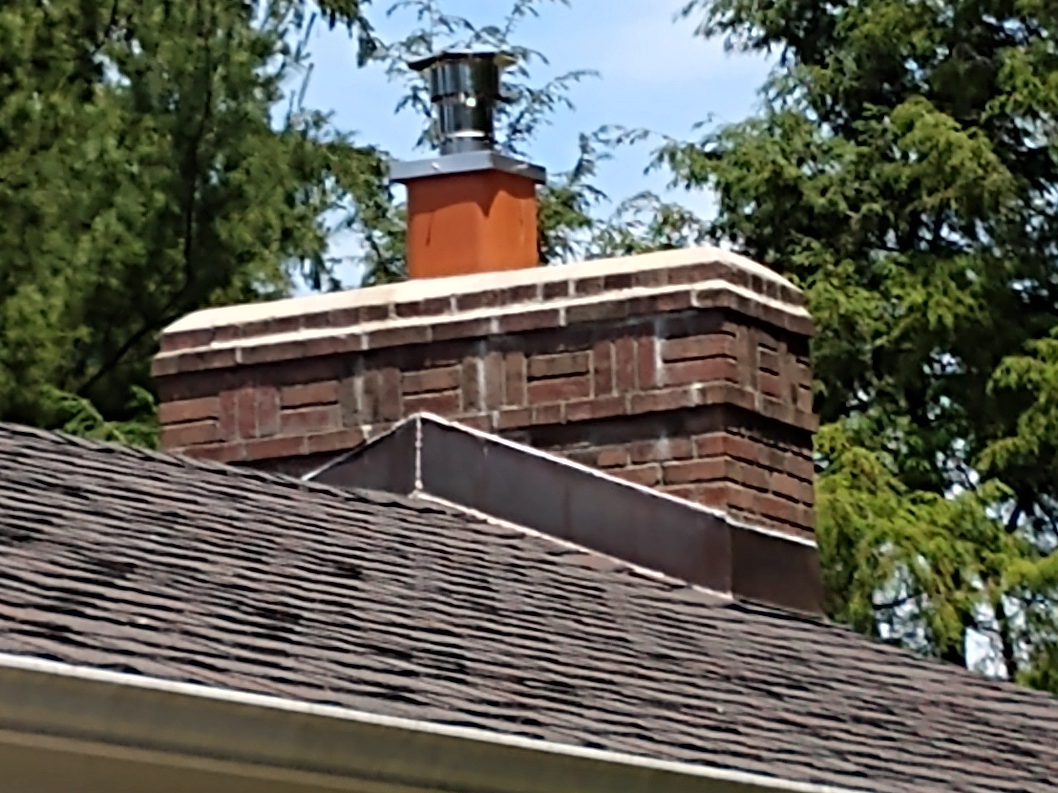 Stainless steel chimney cap with animal guard in Amityville, New York
